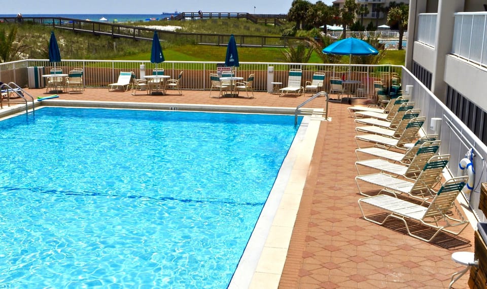 Outdoor pool just outside your balcony.