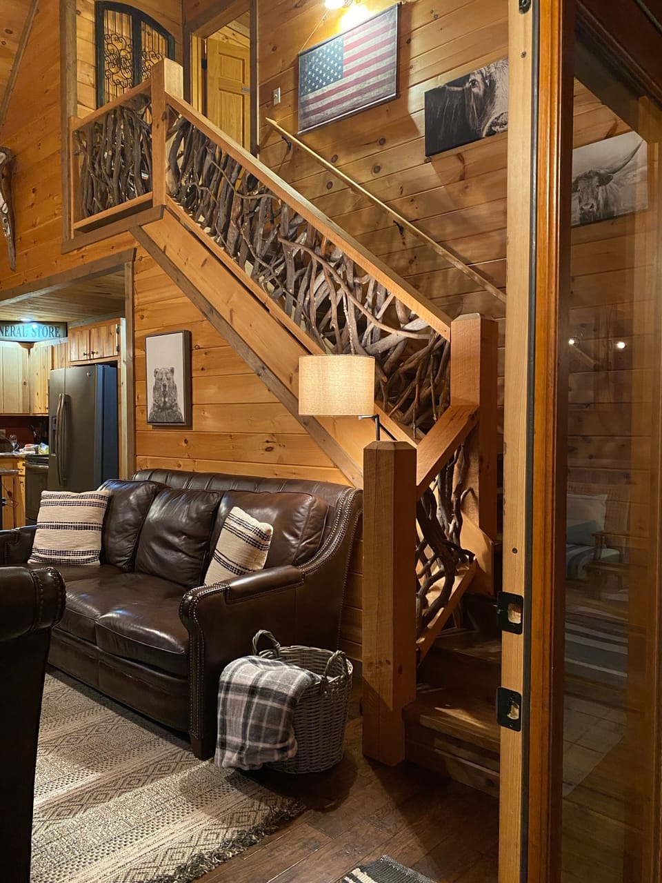 Inviting Living Room with Custom Railing Leading to Master Suite