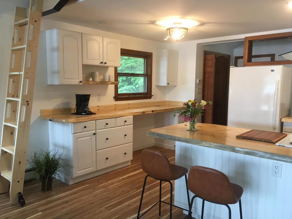 The coffee bar near the ladder for loft storage (not accessible to guests)