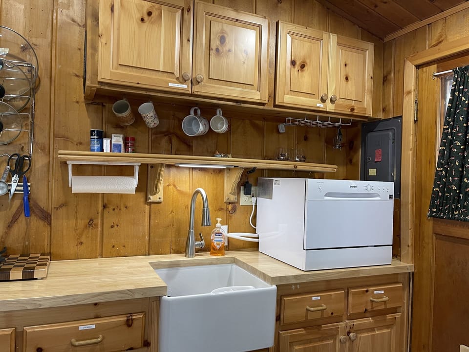 That is a dishwasher on the counter in the corner. 