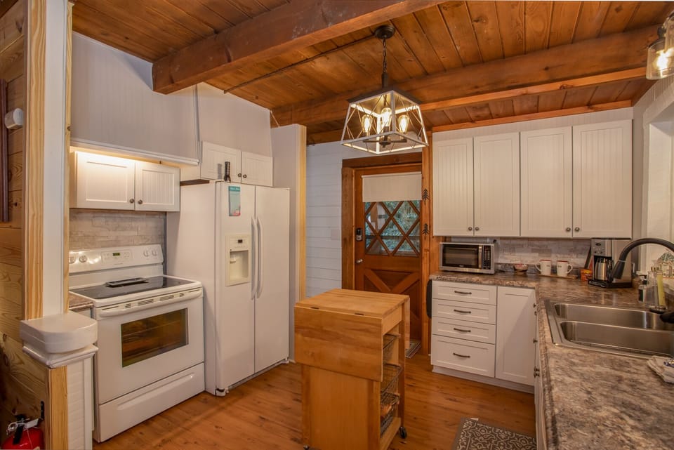Double Sink and Flat Surface Cooktop in Kitchen