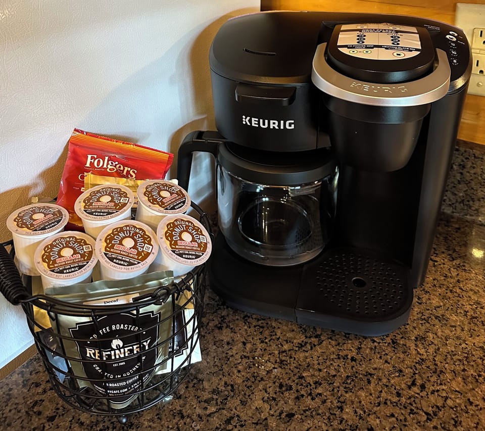 Pods or reg. coffee, also a large reg. coffee, creamer & sweetener.
