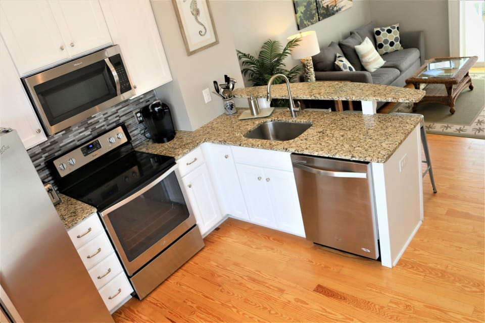 Open, spacious kitchen with coffee maker