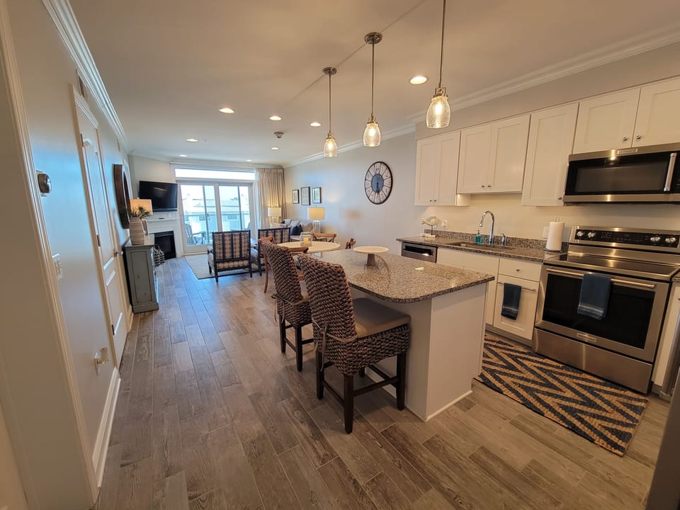 Modern kitchen with island seating and separate dining table for 4.