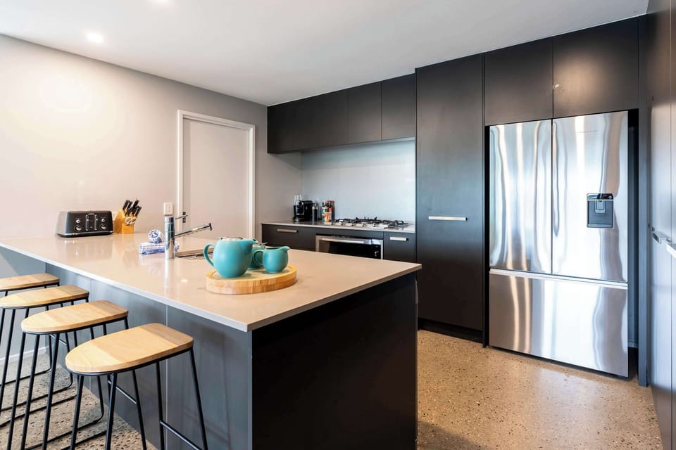 The well-appointed kitchen has quality appliances, butler’s pantry and Nespresso coffee machine, while a distinctive stone island bench with bar stools will be the site for sharing food and conversation.