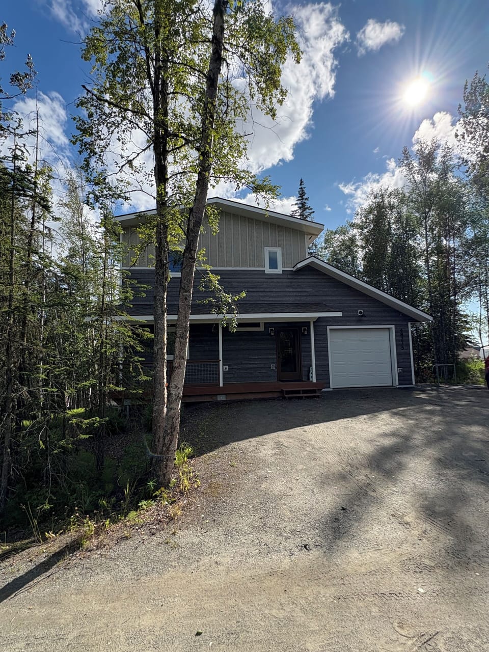 The front of the home with parking area for 2 cars.