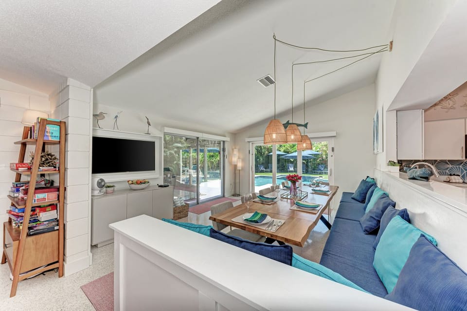 One More Day looking at the dining room towards the back of the house through the two sliding glass door