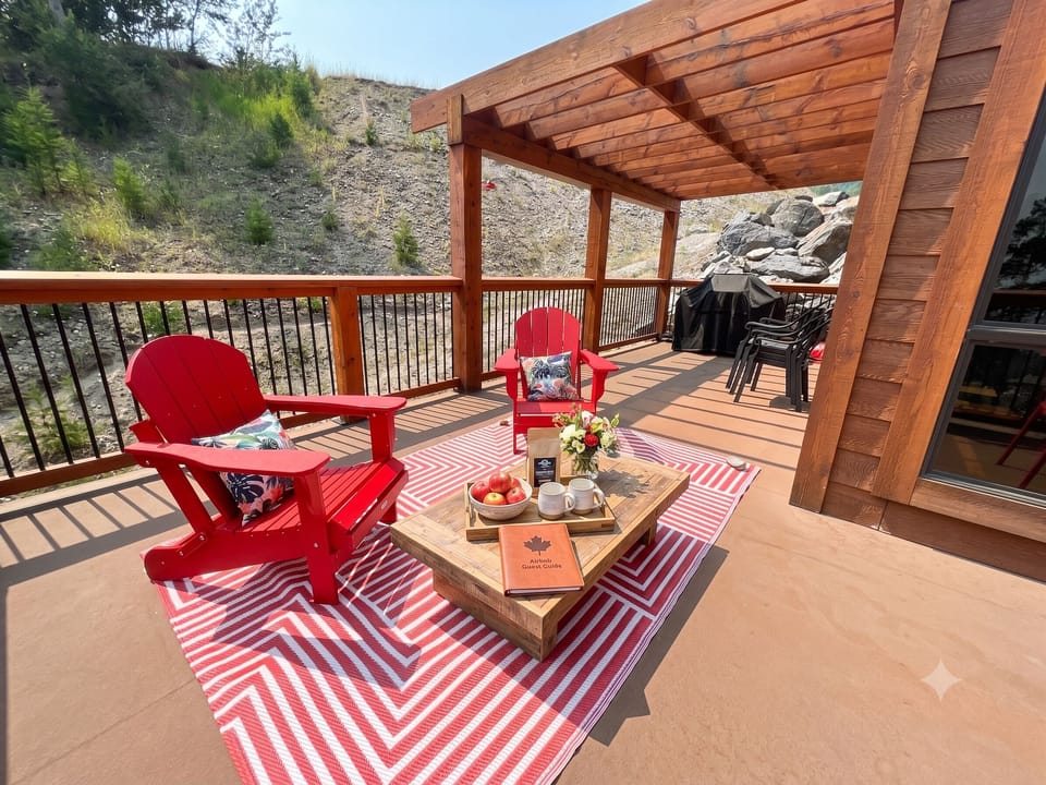 Huge main-floor deck with seating and gas BBQ.