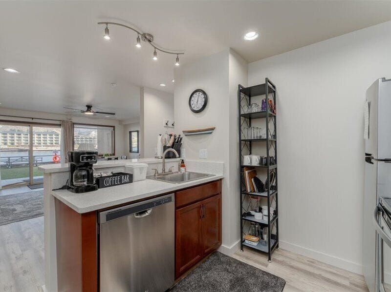 Your modern kitchen awaits with sleek appliances, granite counters, and a coffee bar perfect for morning rituals.