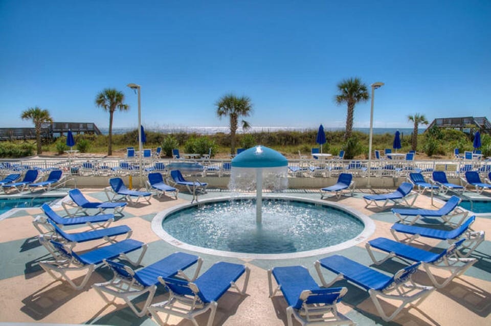Catch some rays while the little ones splash in the kiddie pool.