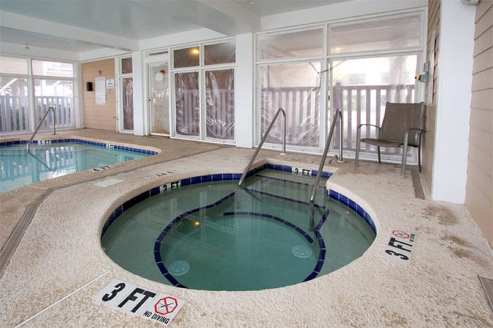 Soak in the hot tub while the kids splash in the pool.