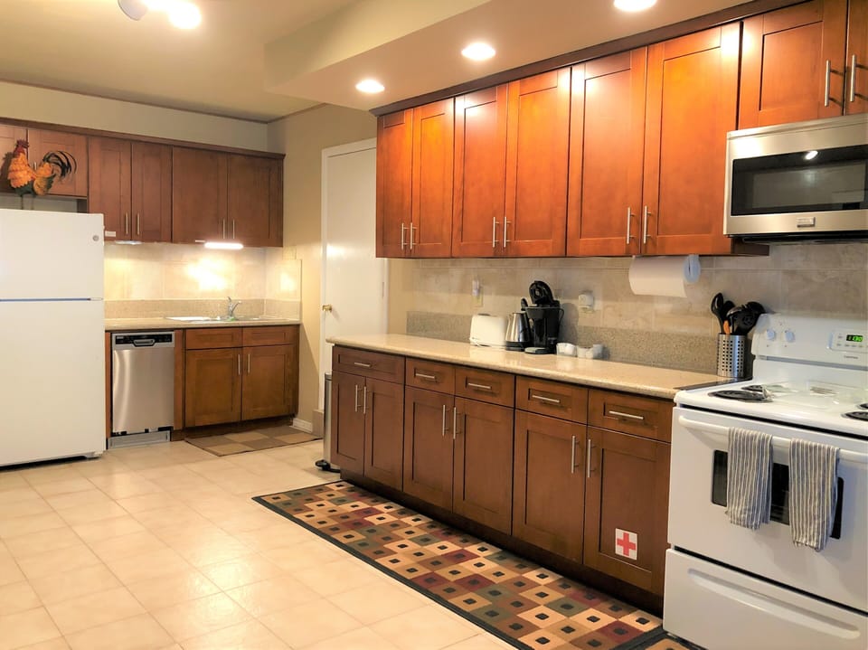 Full size kitchen with refrigerator, dish washer, stove & oven, toaster...