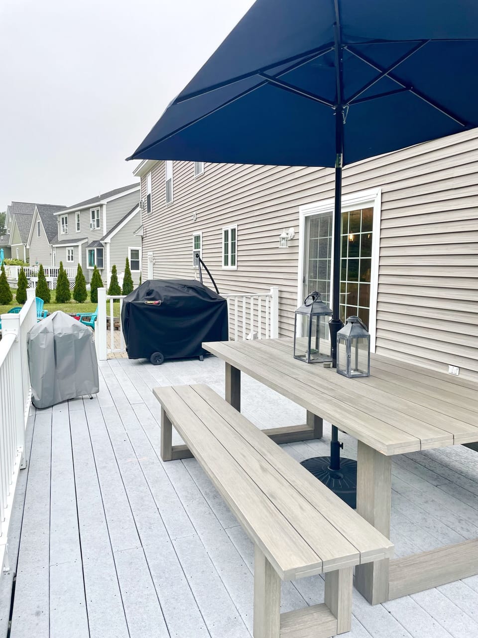 Back deck with large table & gas as well as charcoal grills.
