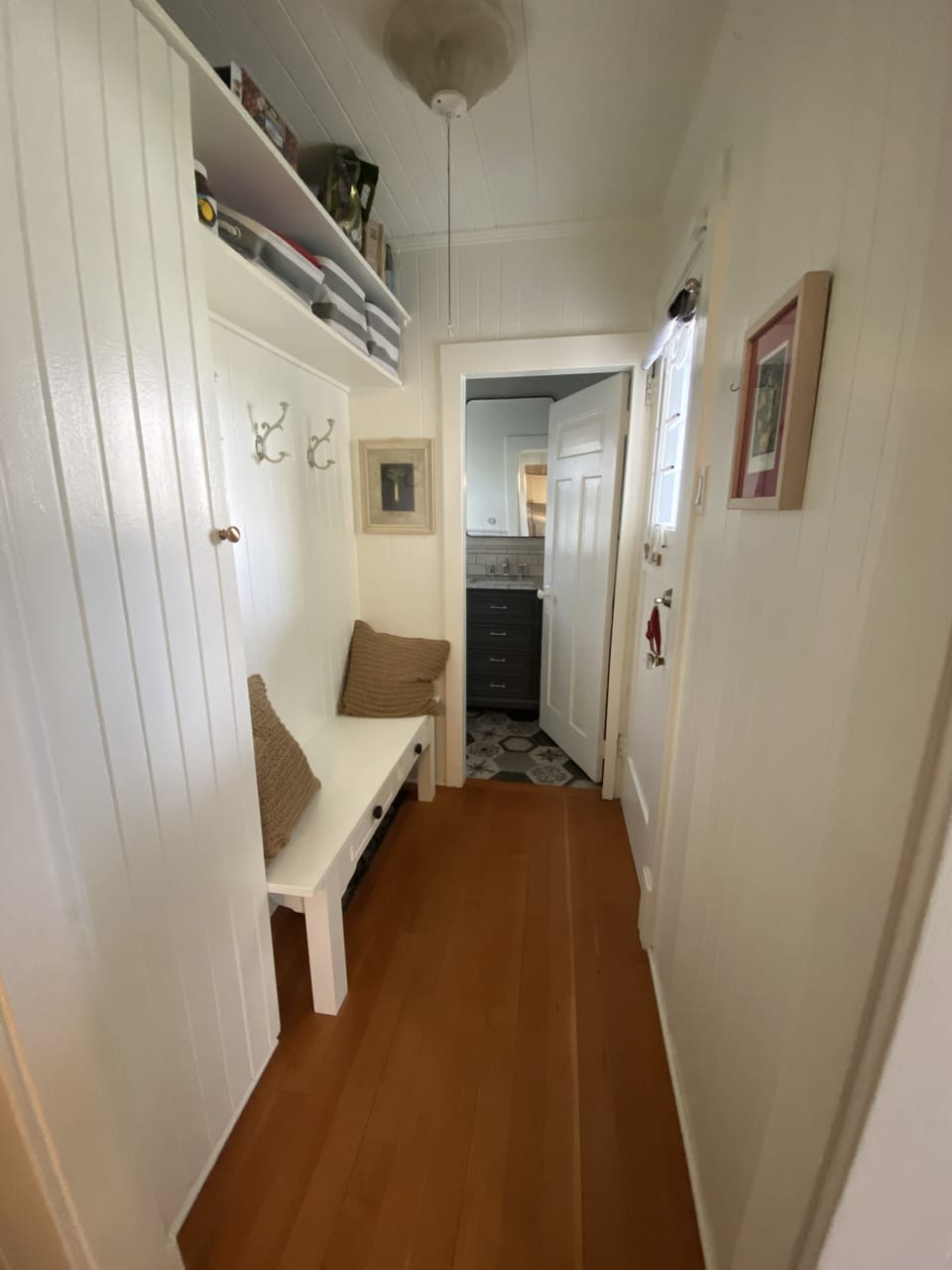 Hallway to main floor bathroom and access the backyard