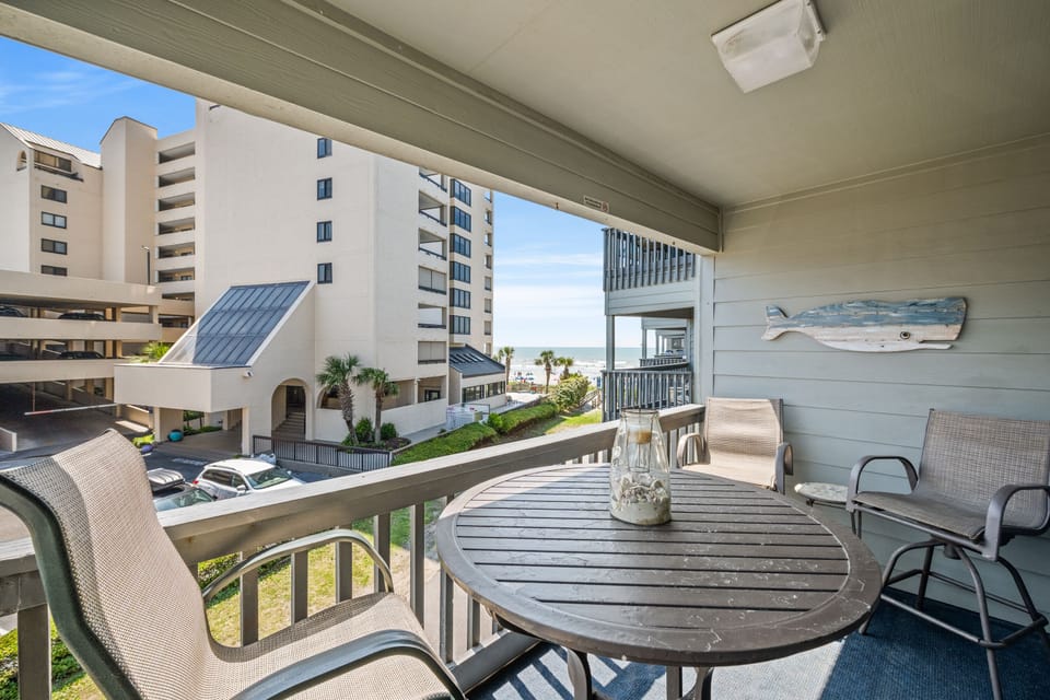 Sit outside and relax on this ocean view balcony and listen to the waves.