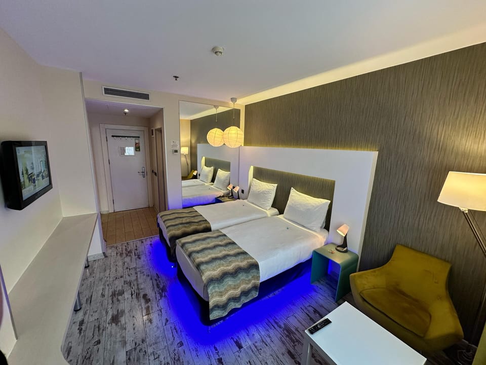 Premium bedding, minibar (some free items), in-room safe, desk