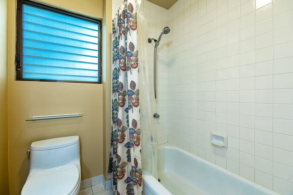 Guest bathroom with a shower and tub
