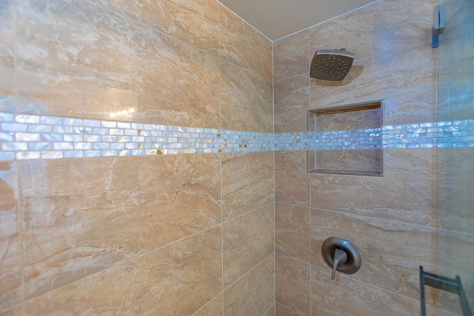 Elegantly tiled walk in shower.