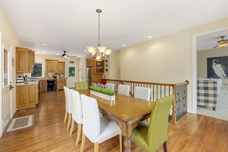 Enjoy a family-style meal around our formal dining table with views of lush greenery and Beaver Lake.