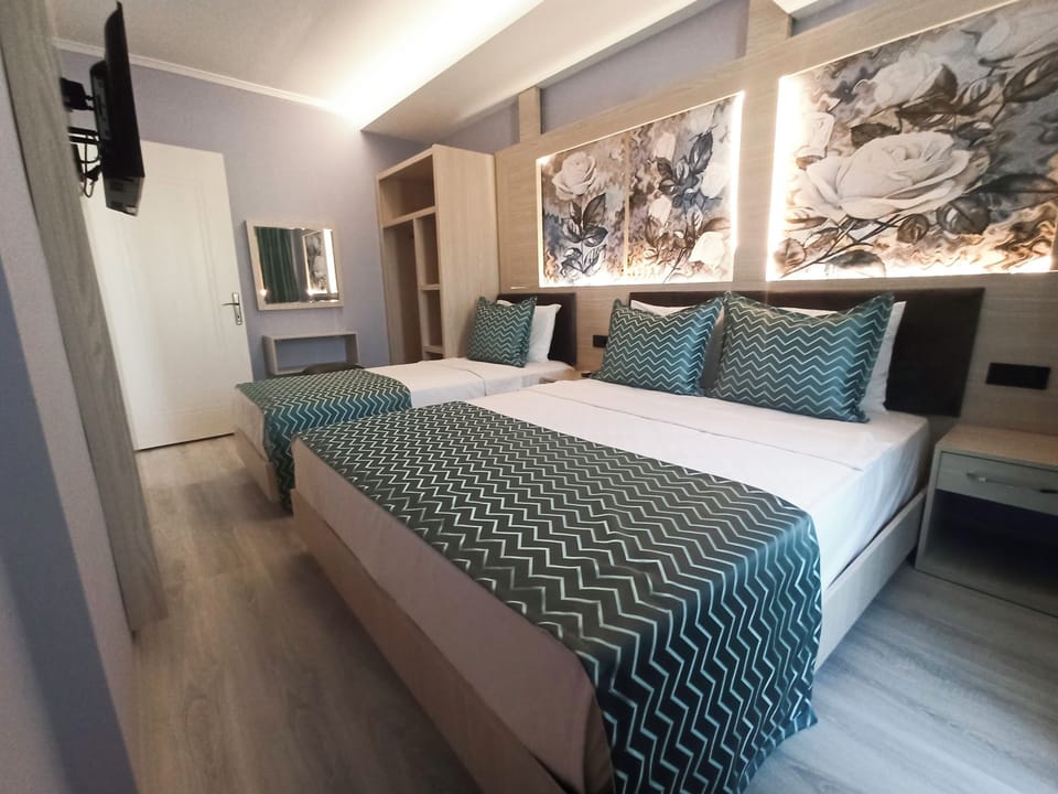 Family Room | Minibar, in-room safe, individually decorated, free WiFi
