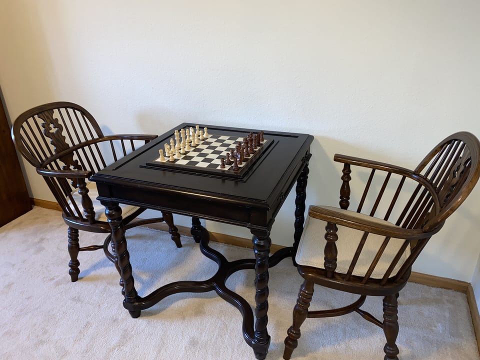 Game table with chess, checkers and backgammon boards.