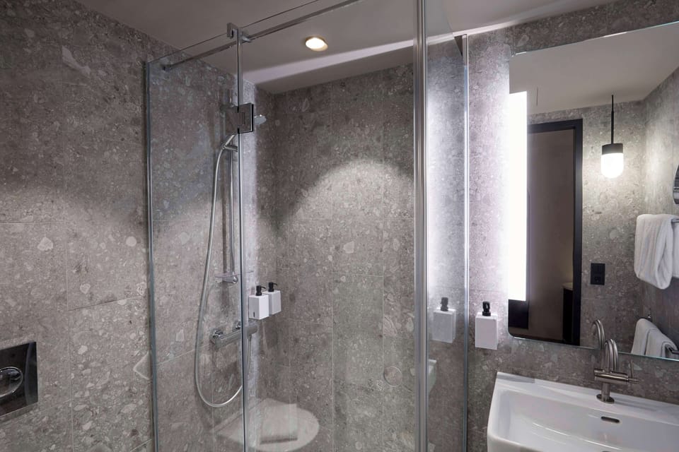 Shower, eco-friendly toiletries, hair dryer, towels
