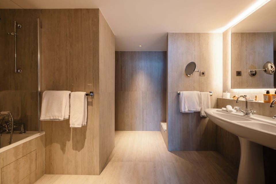 Designer toiletries, hair dryer, bathrobes, slippers