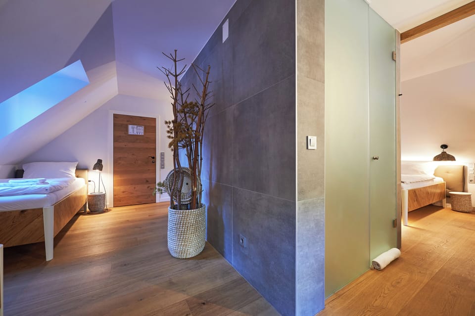 Family Room | Minibar, in-room safe, desk, bed sheets