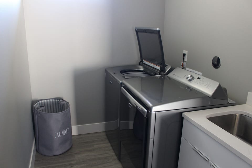 Laundry room with Maytag washer and dryer. 