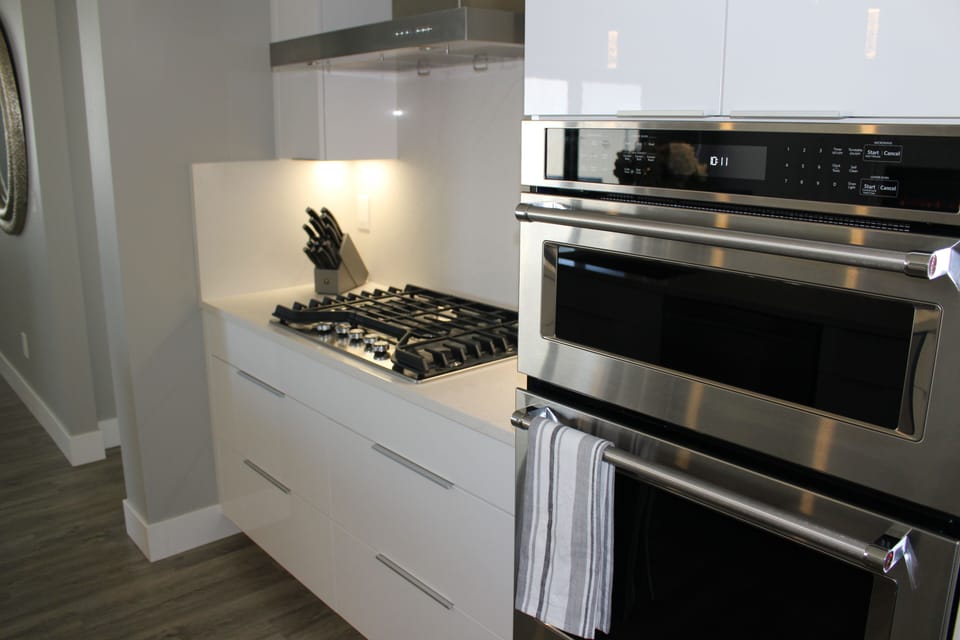 Gas range and Kitchen Aid microwave and oven. 