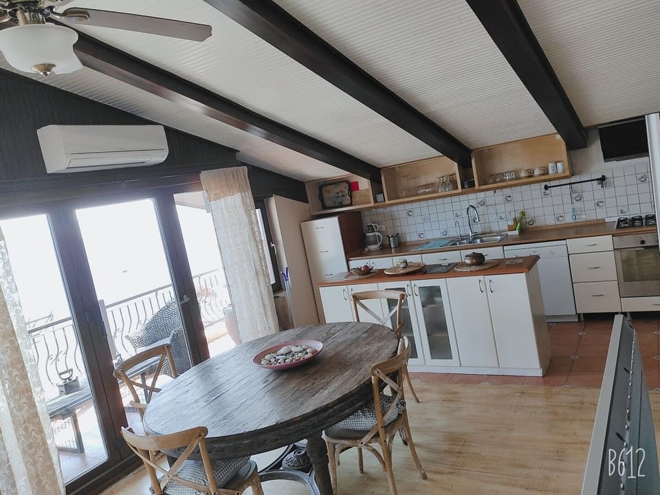 Panoramic Penthouse | Private kitchen | Fridge, oven, stovetop, dishwasher
