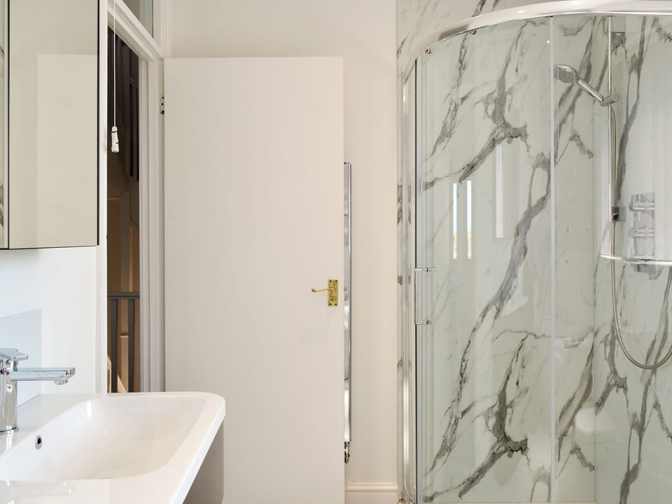 Family bathroom with shower cubicle and bath | Harbour Gates, Maryport
