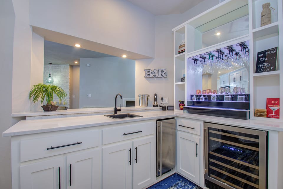Wet bar with wine & full size fridge, & ice machine 