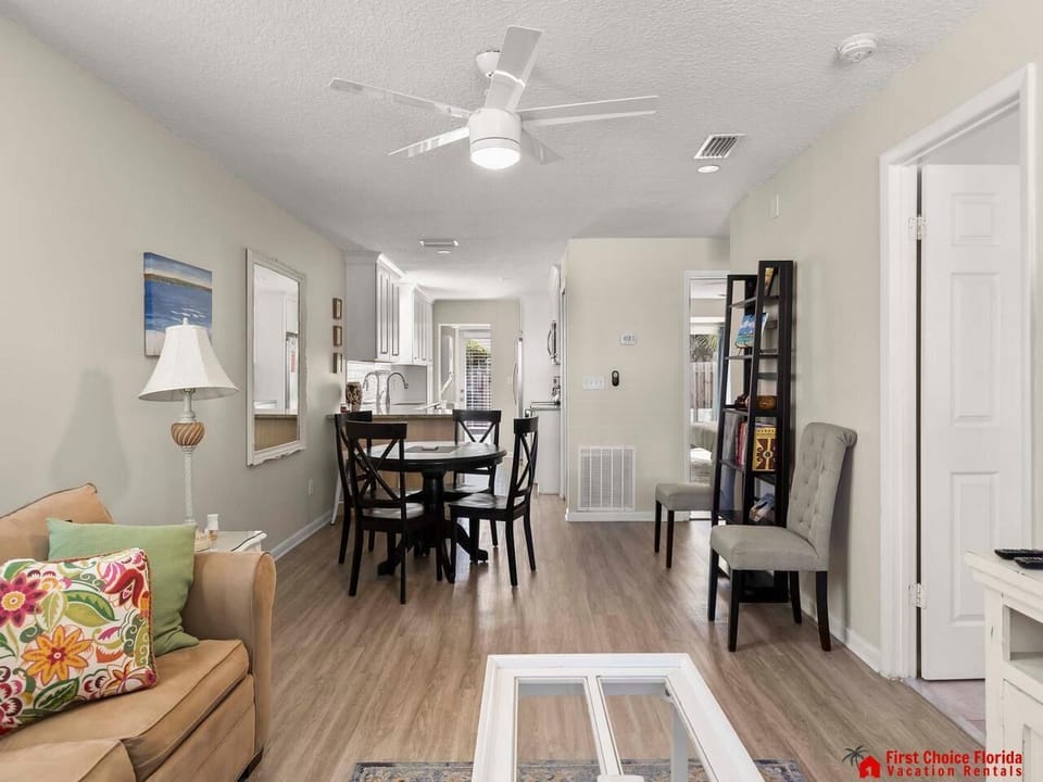 Bright and airy living and dining area with cozy seating