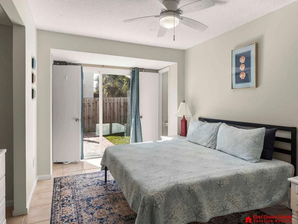 Bright bedroom with garden access and cozy ambiance