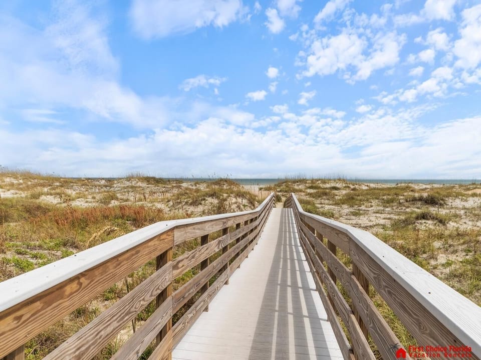 Scenic boardwalk leading to tranquil beach escape