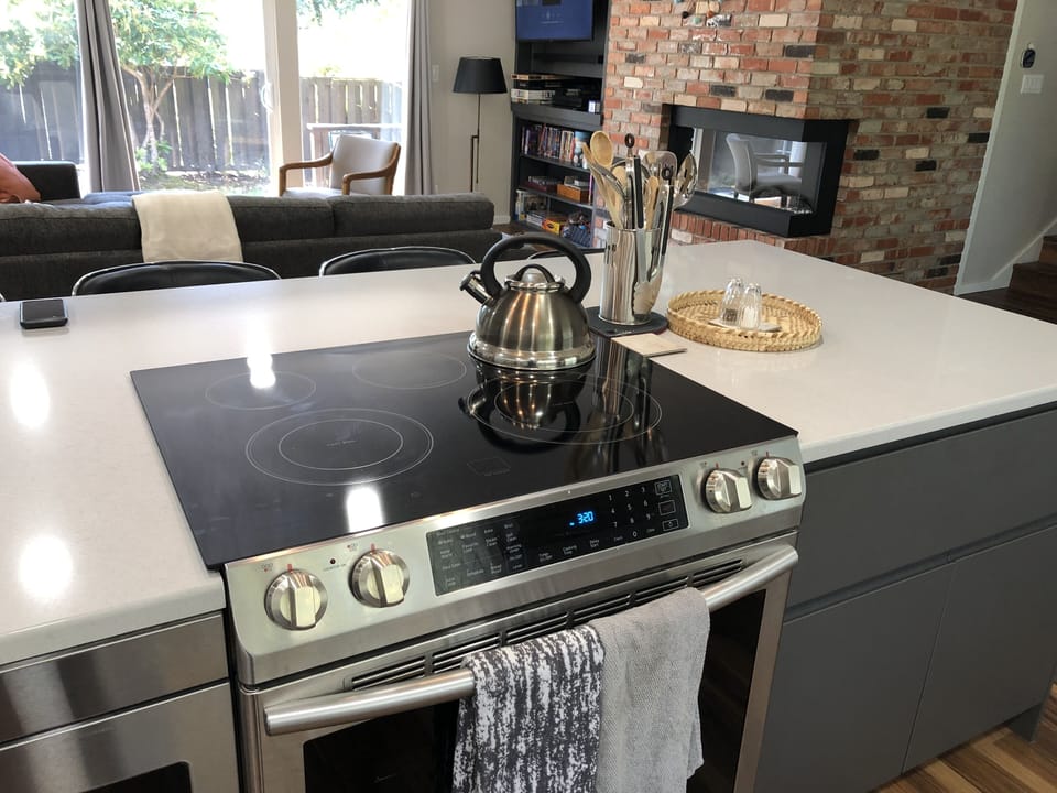 Huge kitchen island with new range and drawer microwave