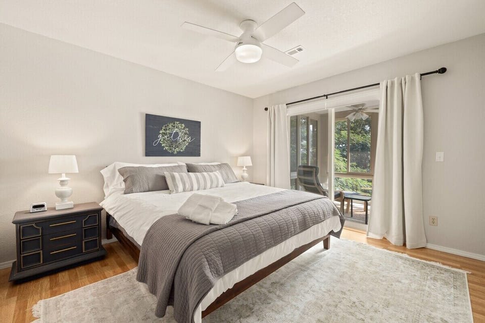 Our home's second King bedroom has lake views plus DIRECT ACCESS to the indoor-outdoor patio through sliding doors.