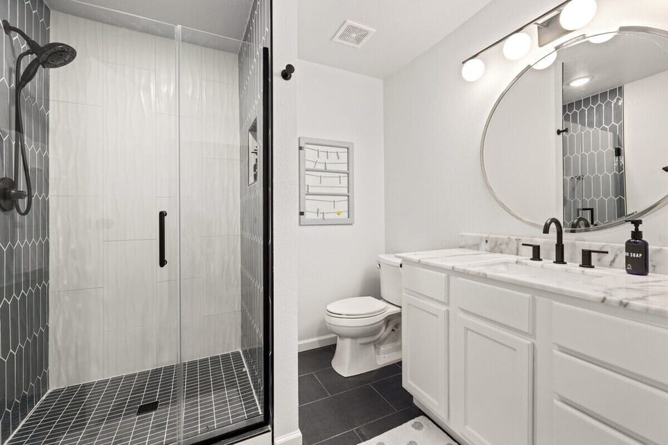 NEWLY RENOVATED!! This bathroom features a spacious walk-in shower + fully stocked.