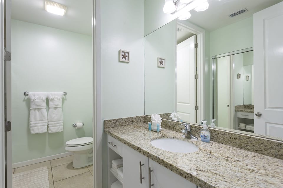 The spacious primary bathroom provides plenty of room to get ready each day.