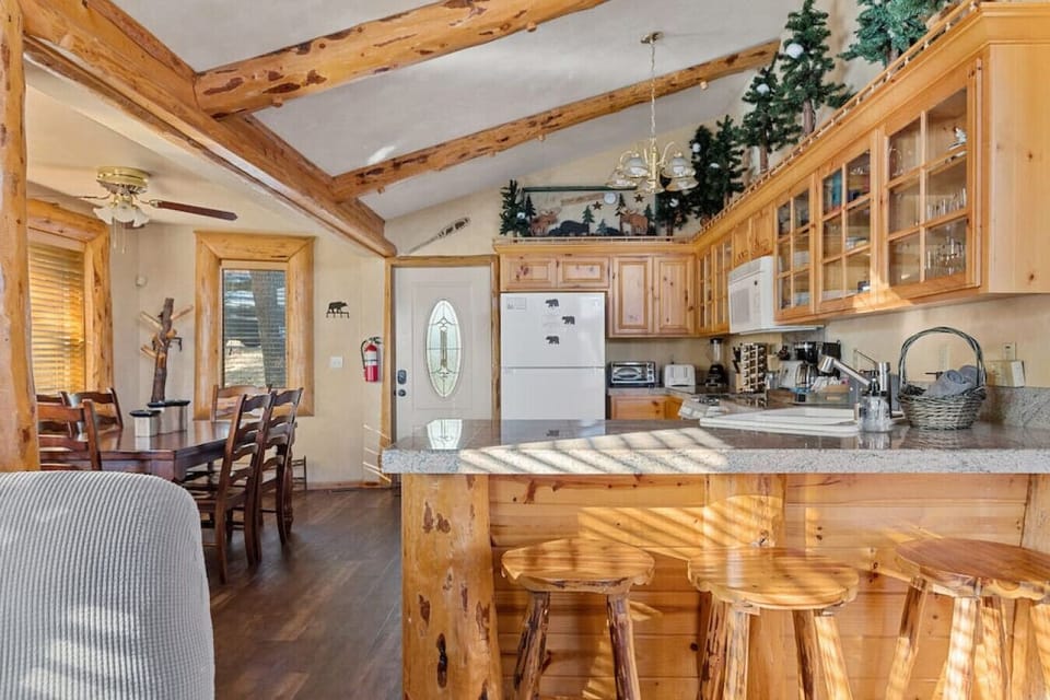 Breakfast bar and fully stocked kitchen with all of the amenities of home.