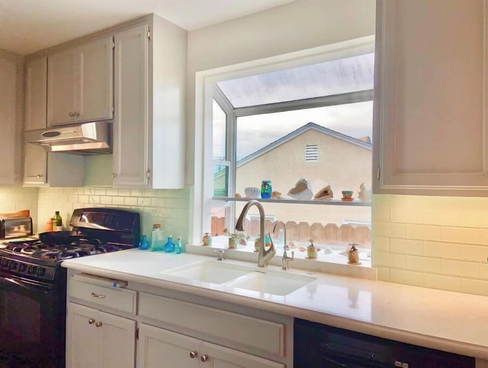 Double porcelain sink with quartz countertops.  Filtered water for cooking. 