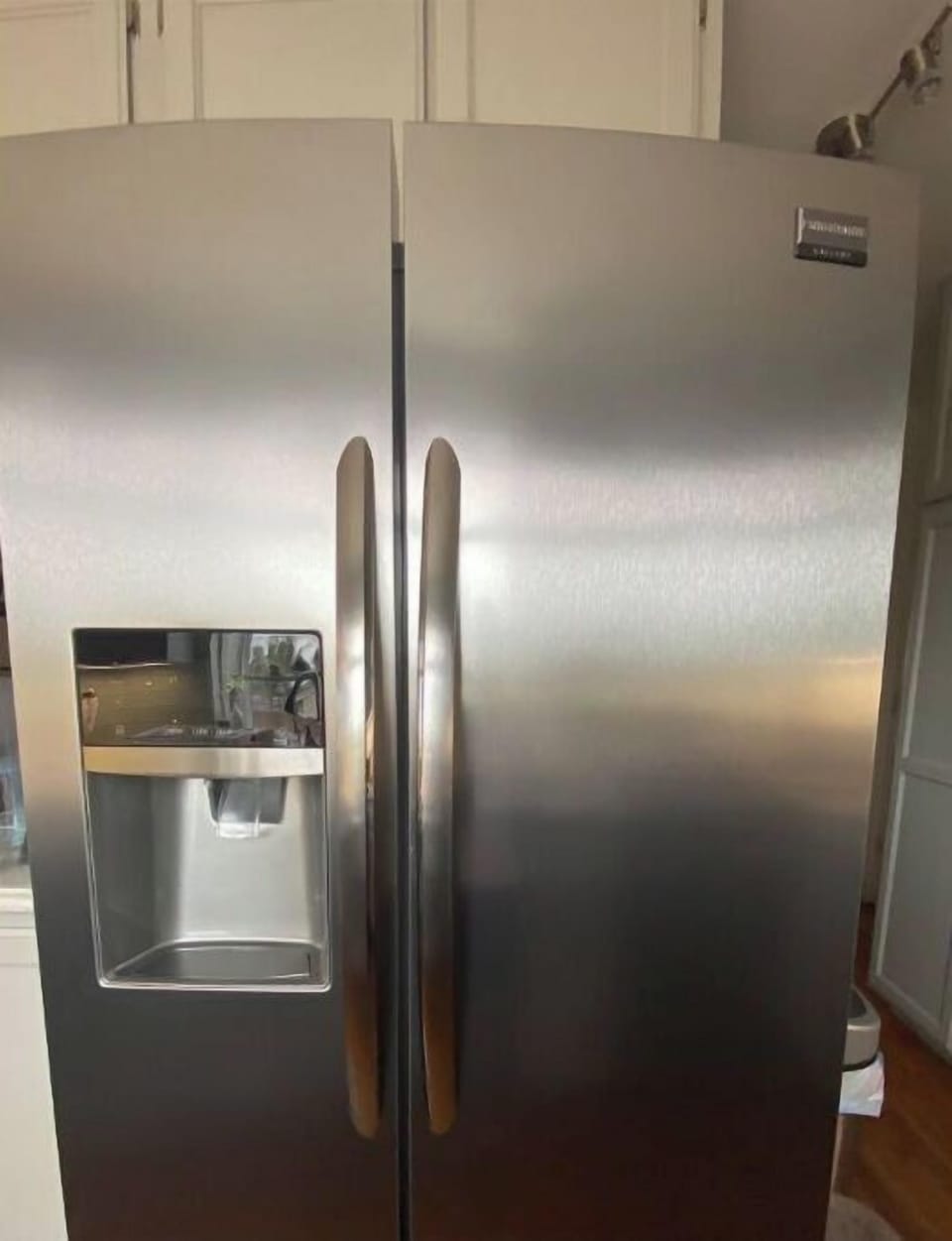 Large stainless steel refrigerator with chilled water and ice dispenser