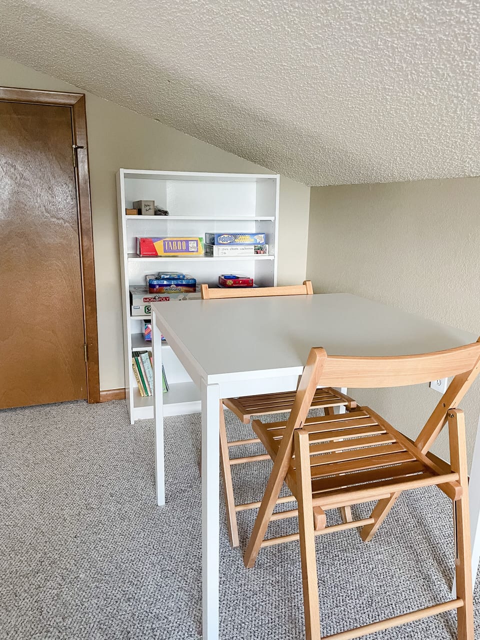 The loft has a bedroom, a space with board games and a futon. 