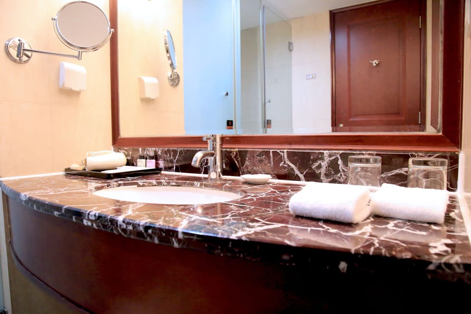 Shower, hair dryer, slippers, towels