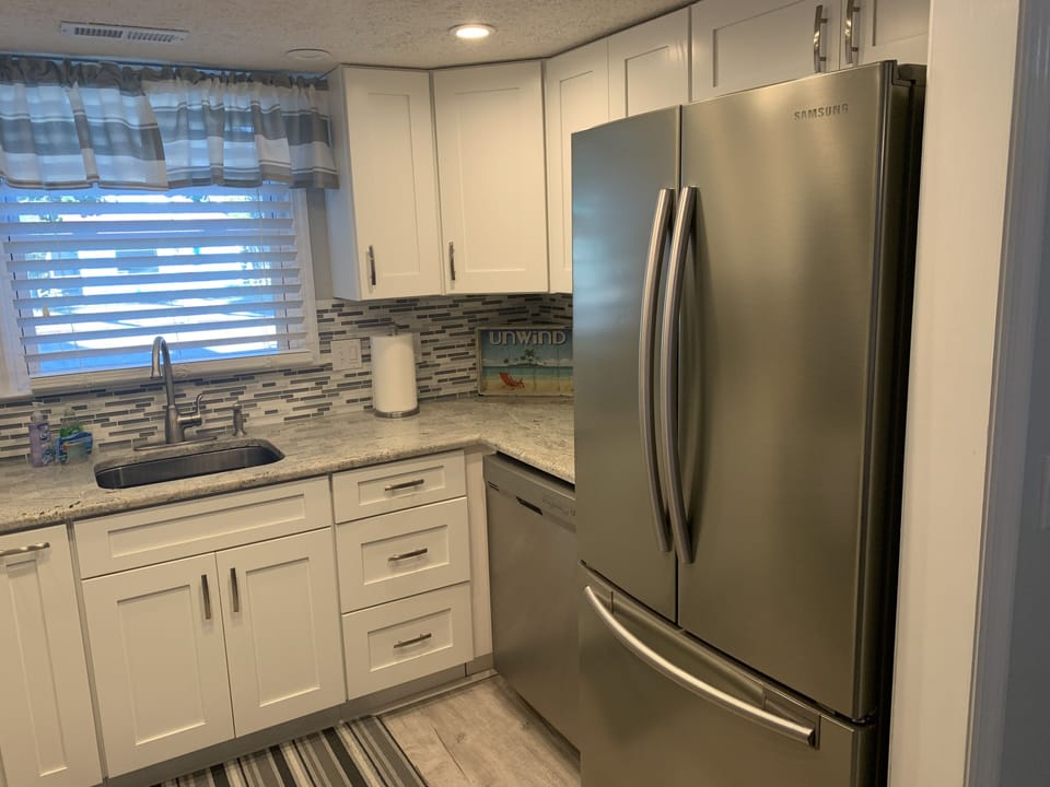 Dishwasher and large refrigerator to hold all your items.