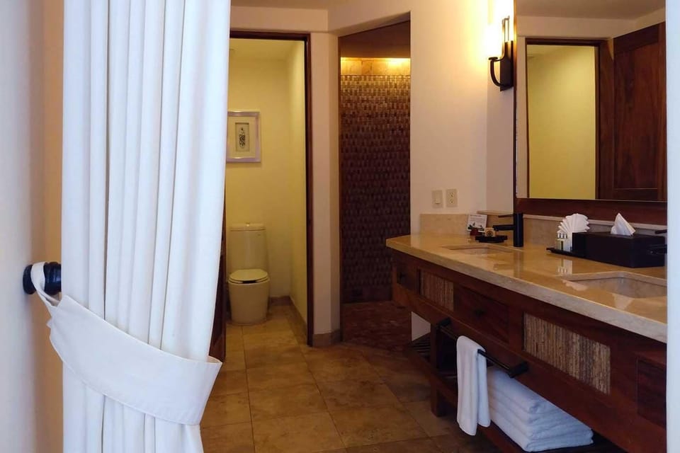 Design Room, Multiple Beds, Oceanfront | Bathroom | Shower, designer toiletries, hair dryer, bathrobes