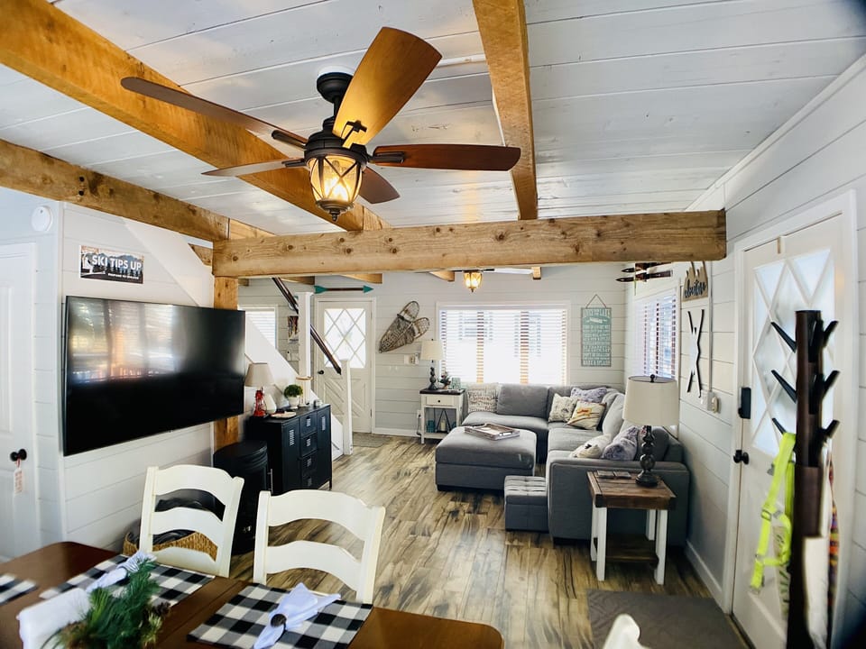 Large TV with several streaming apps included, large sectional sofa