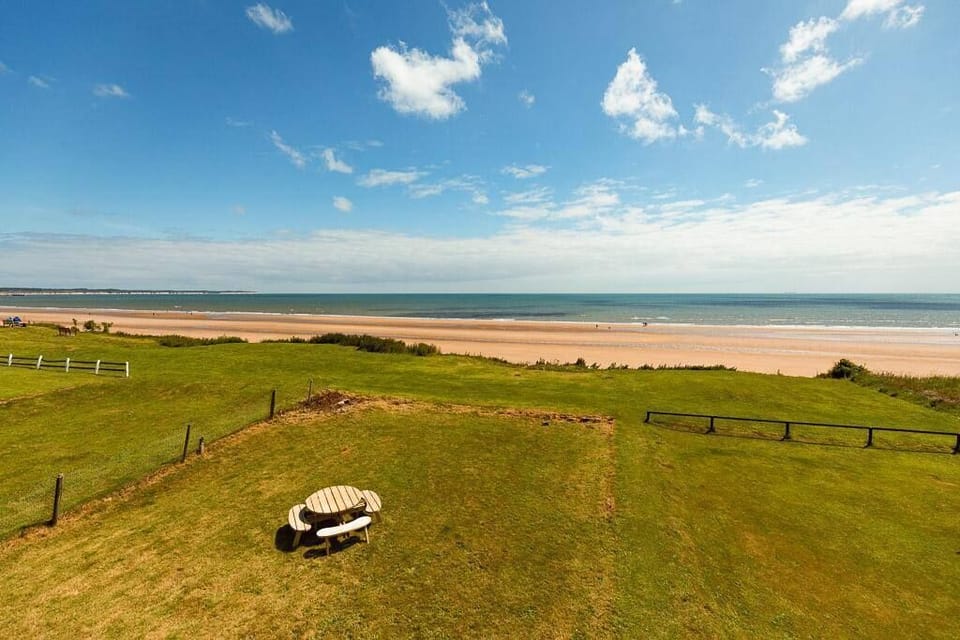 Seating space out the back of the property, leads to the beach