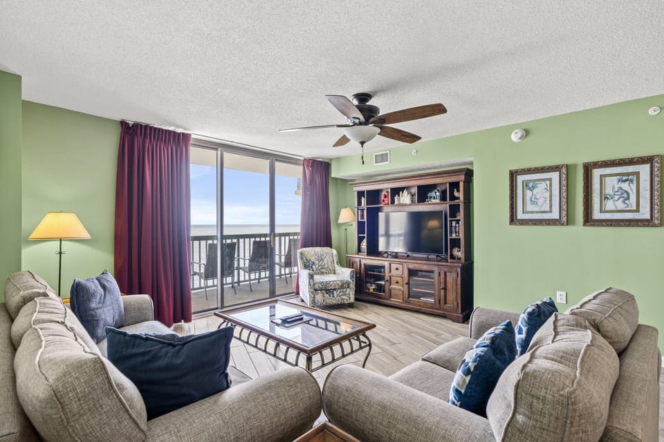 The ocean front living room is well-appointed with comfortable furnishings.